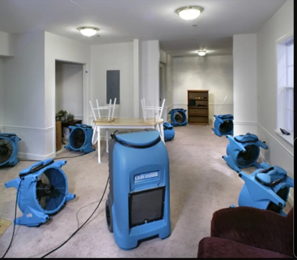Air movers and dehumidifier setup for Water Damage Restoration in Zimmerman